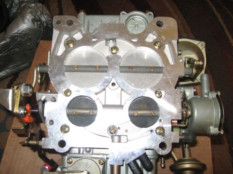1981 Ford Bronco - A Holley 4-barrel carburetor is shown, its internal components and external linkages.