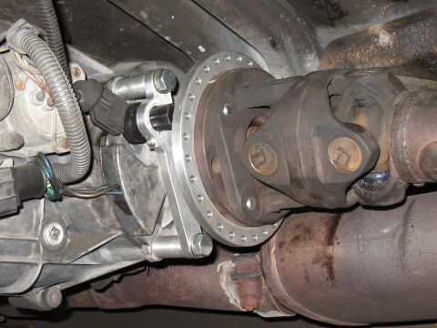 1994 Ford Bronco - Custom adapter plate installed between transmission and driveshaft for a vehicle modification.