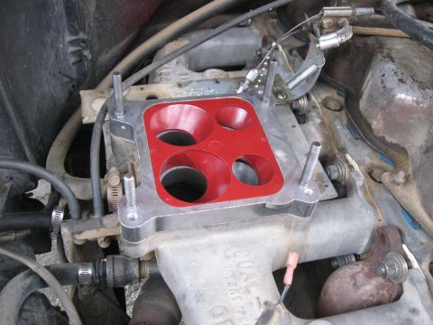 1981 Ford Bronco - This image shows a close-up of a carburetor and intake manifold, not a 1981 Ford Bronco.