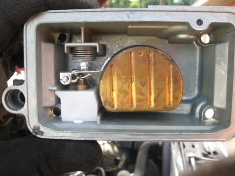 1981 Ford Bronco - Close-up view of a carburetor's internal components, including the float bowl and float assembly.