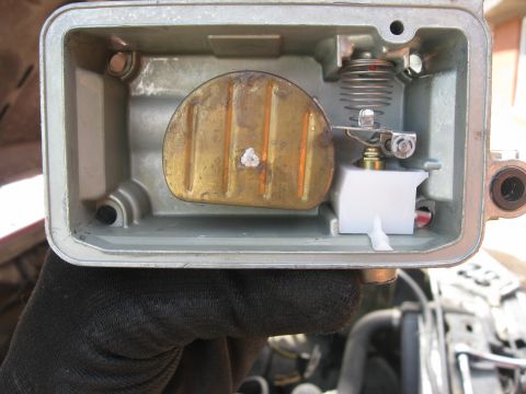 1981 Ford Bronco - Close-up view of a carburetor's internal components, showing the float and spring.