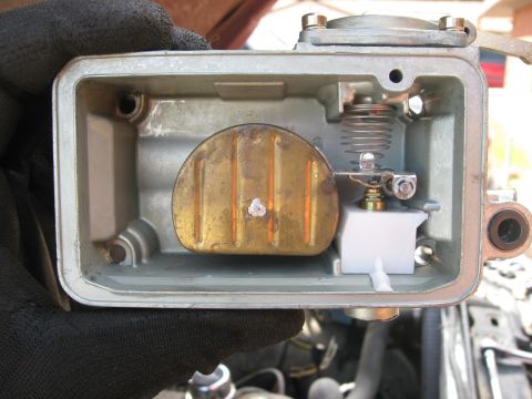 1981 Ford Bronco - Close-up view of a carburetor's internal components, including the float and needle valve assembly.