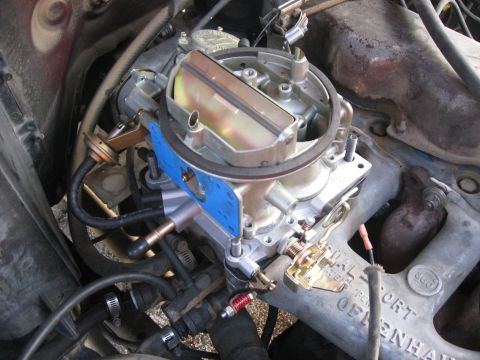 1981 Ford Bronco - A new Holley carburetor is installed on the engine, replacing the old one.