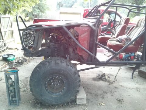 1986 Ford Bronco - This custom-built buggy is undergoing modifications, with its engine and interior exposed for work.