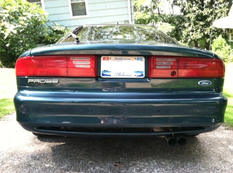 1997 Ford Probe - Rear view of a dark green 1997 Ford Probe with dual exhaust pipes and an Alabama license plate.