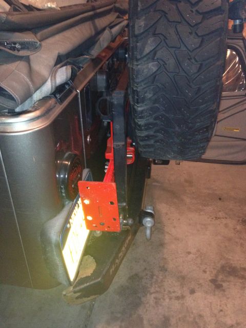2005 Jeep Wrangler - Rear view of a 2005 Jeep Wrangler showing spare tire, Hi-Lift jack, and bumper.