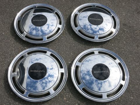 1991 Ford LTD Crown Victoria - Set of four 'Caprice' labeled hubcaps, likely for a Chevrolet Caprice.
