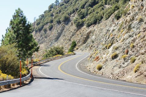 1995 Ford Taurus - A scenic view of a winding road through a mountainous landscape.