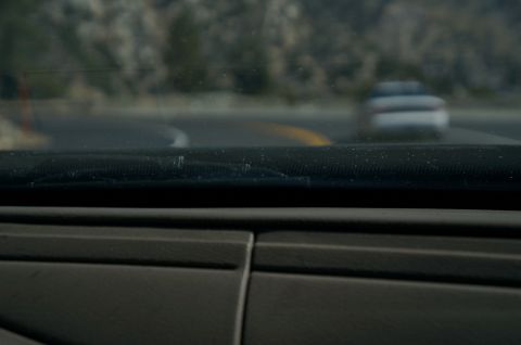 1995 Ford Taurus - A car drives on a winding road, seen from the perspective of another vehicle's interior.