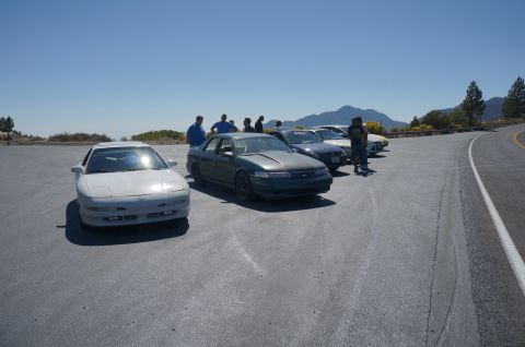 1995 Ford Taurus - A group of cars are gathered at a scenic overlook on a clear day.