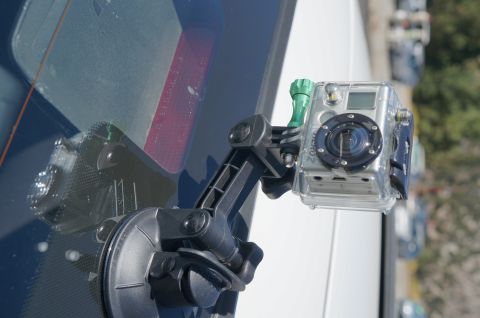 1995 Ford Taurus - A GoPro camera is mounted inside a vehicle, capturing the view through the rear window.