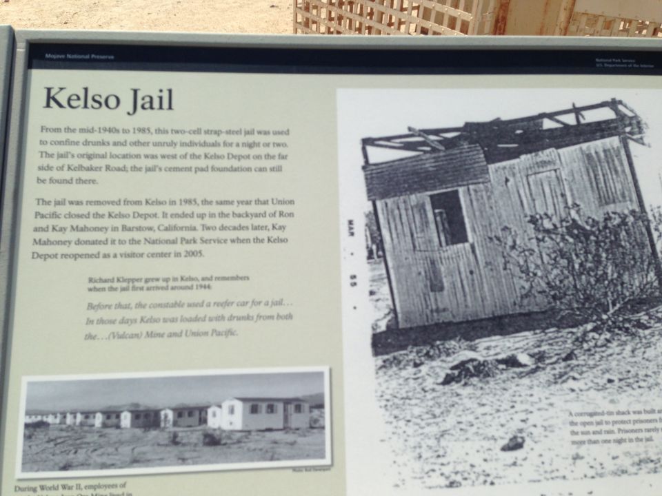 Kelso Jail historical marker with text and photos of the jail and buildings