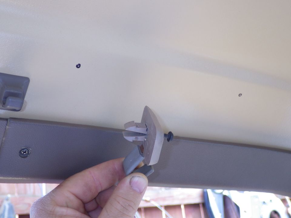 Only the wide tip of the base goes through the sheet metal - the tiny stops are barely visible that provide standoff for a headliner.  I carefully chose the location for the handle & marked the centers on the roof to be "square-drilled".

See the NEXT few pics & captions...