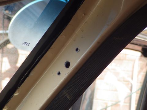 1983 Ford Bronco - I temporarily mounted the bracket, ran the bolt in against the A-pillar to mark it, removed the bracket, and drilled the oversized pilot ho…