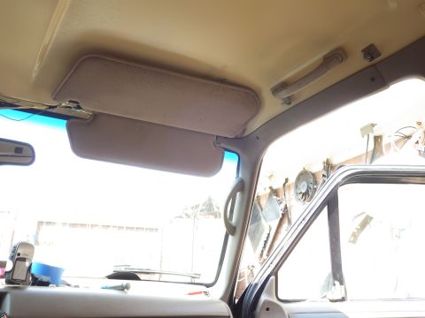 1983 Ford Bronco - Install the trim over the bolt holes, then use the tape to transfer the bolt hole positions onto the trim. Use a Dremel to cut out for the…