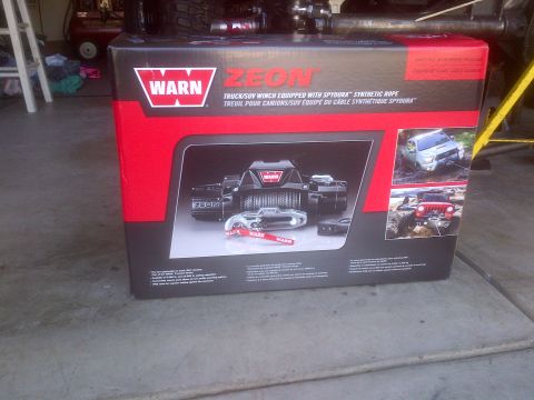 1985 Jeep CJ7 - The box displays a Warn Zeon winch and images of vehicles using winches off-road.