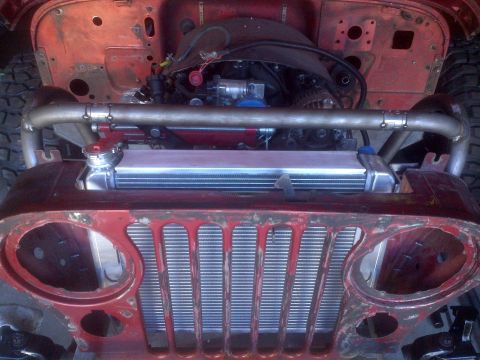 1985 Jeep CJ7 - Front view of a Jeep CJ-series showing the engine and radiator assembly.