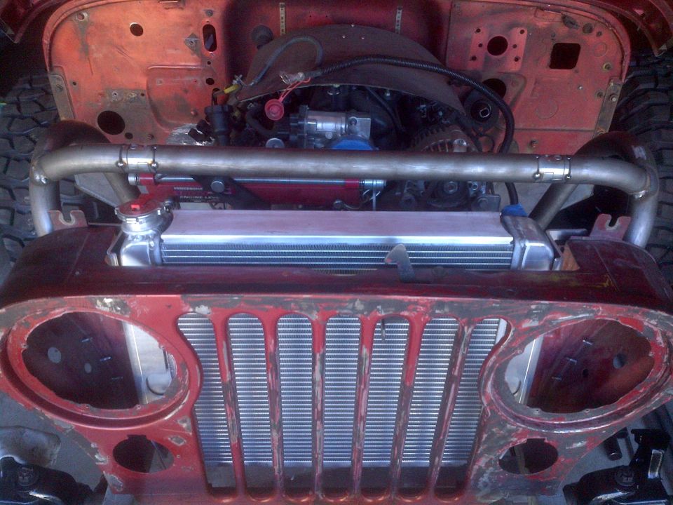 Jeep CJ-series front end with engine and radiator exposed