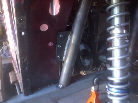 1985 Jeep CJ7 - Custom suspension and roll cage work on a Jeep CJ frame, likely for off-road use.