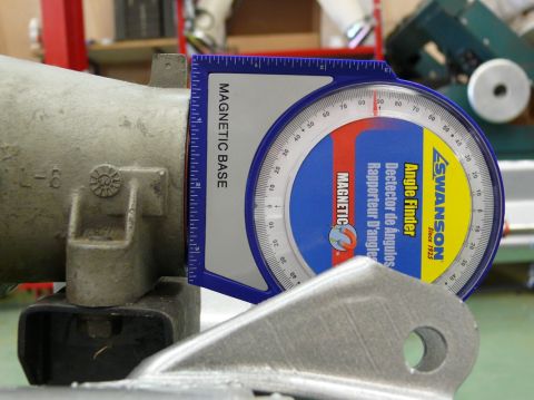 1976 Chevrolet Corvette - A Swanson angle finder is used to measure the angle of a metal part.