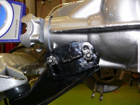 1976 Chevrolet Corvette - Close-up of a vehicle's differential housing with a magnetic base angle finder attached to a bracket.