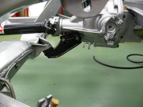 1976 Chevrolet Corvette - Close-up view of the rear differential and driveshaft assembly, likely from a classic car undergoing restoration.