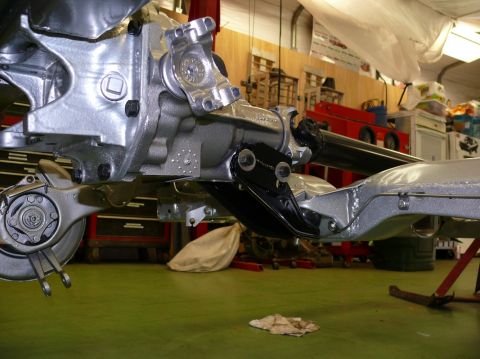 1976 Chevrolet Corvette - Close-up of vehicle's rear suspension and drivetrain components during restoration.