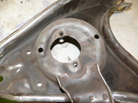 1976 Chevrolet Corvette - This is a close-up view of a metal car suspension part, likely a control arm or strut mount.