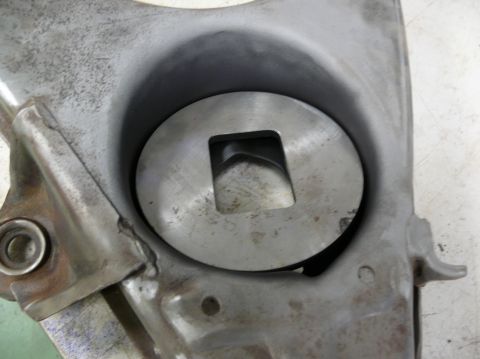 1976 Chevrolet Corvette - This image shows a close-up of a metal component, likely a part of a larger assembly, a circular recess with a square aperture.