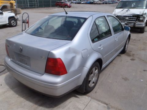 2002 Volkswagen Jetta - Silver 2002 Volkswagen Jetta sedan with damage to the rear passenger-side quarter panel.