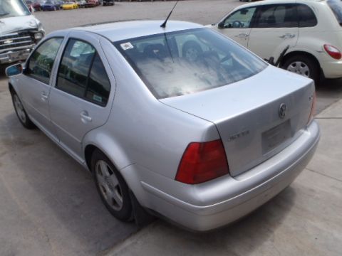 2002 Volkswagen Jetta - A silver 2002 Volkswagen Jetta is parked in a lot with other vehicles.