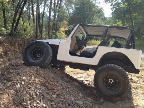 2000 Jeep TJ - This modified Jeep Wrangler appears to be from the TJ generation, likely a 1997 model, not a 2000.