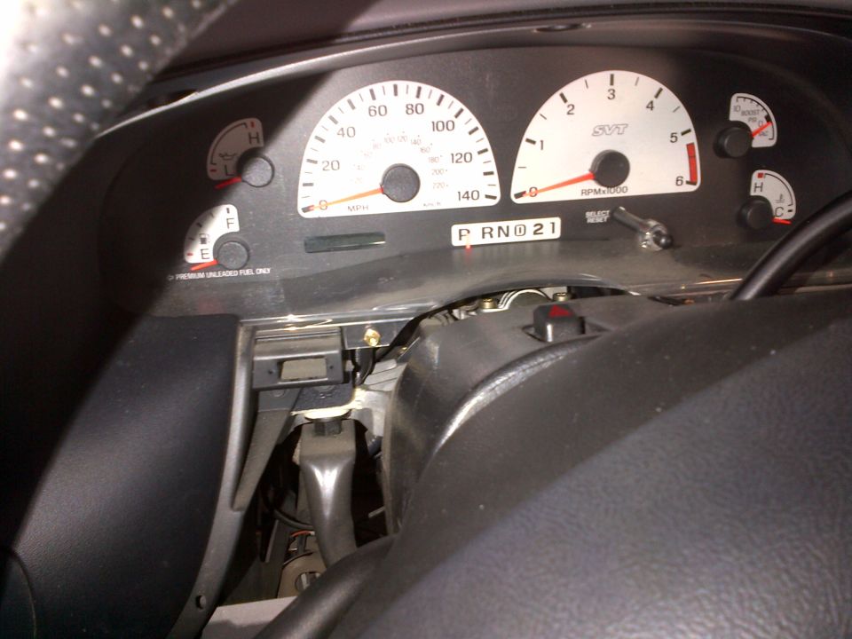 Dashboard gauges of a 2003 Ford F-150 Lightning, showing speedometer, tachometer with SVT logo, fuel, and temperature gauges