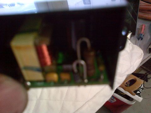 2003 Ford F-150 - An electronic circuit board with visible components is shown in a close-up view.