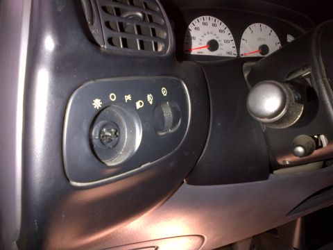 2003 Ford F-150 - Interior view of a 2003 Ford F-150 dashboard, showing the ignition and headlight controls.