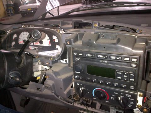 2003 Ford F-150 - Interior view of a 2003 Ford F-150 dashboard, showing the radio and instrument cluster.