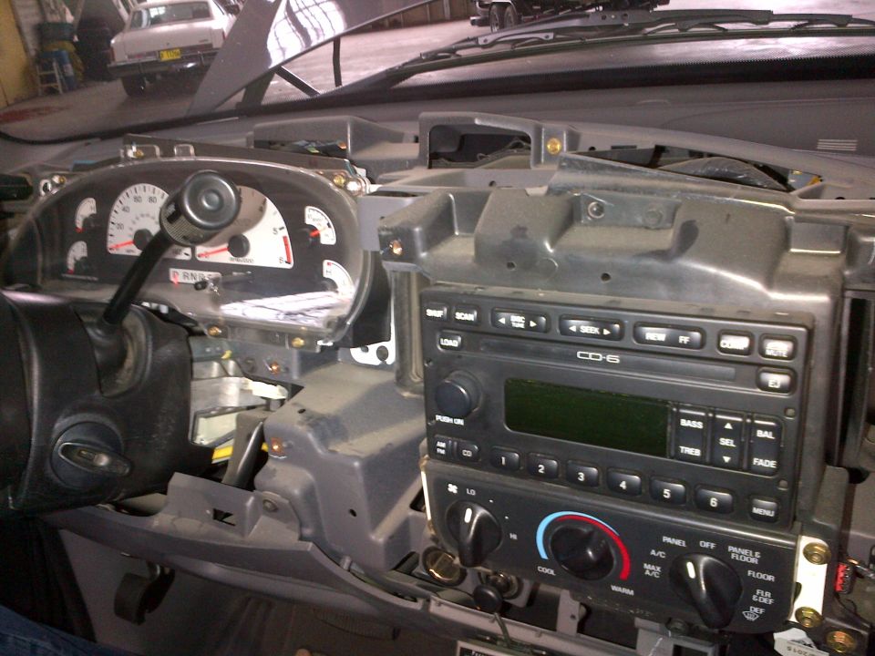 Dashboard of a 2003 Ford F-150 with radio and gauges visible