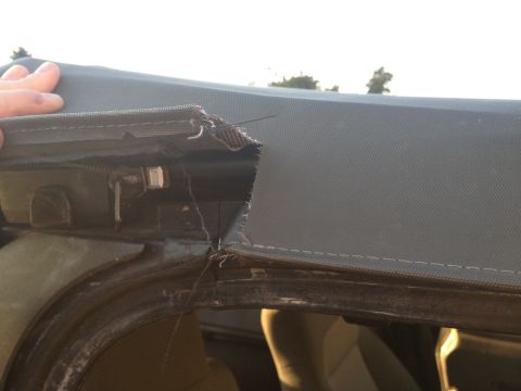 2005 Jeep Wrangler - Close-up of a damaged soft top seam on a 2005 Jeep Wrangler.