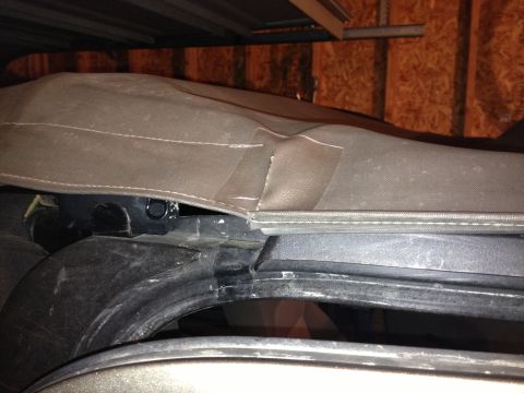 2005 Jeep Wrangler - The soft top on this vehicle has a tear that has been repaired with tape.