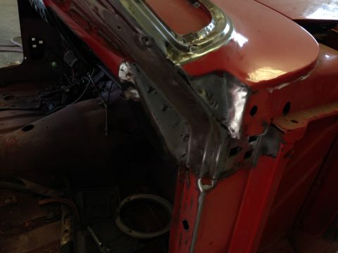 1964 Ford Fairlane - Close-up view of the interior of a red 1964 Ford Fairlane, highlighting bodywork and exposed wiring.
