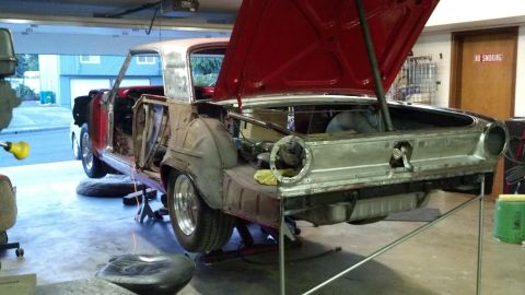 1964 Ford Fairlane - This 1964 Ford Fairlane is in a garage, being worked on with its hood and trunk open.