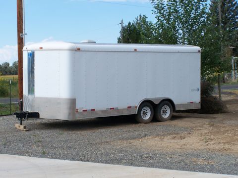 1988 Suzuki Samurai - This is a white cargo trailer with a diamond plate front and red reflectors on the side.