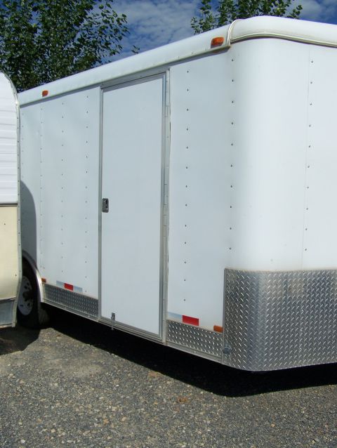1988 Suzuki Samurai - Side view of a white enclosed trailer with a sliding door and diamond plate accents.