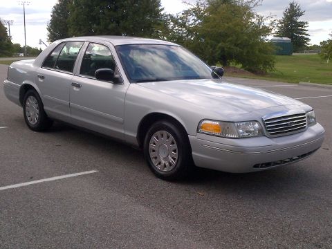 2001 Ford Crown Victoria - Silver 2001 Ford Crown Victoria parked on asphalt, showing its front 3/4 view.