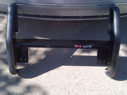 2001 Ford Crown Victoria - Pro-gard bull bar attached to the front of a vehicle.