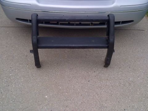 2001 Ford Crown Victoria - A black bull bar is mounted to the front of a silver 2001 Ford Crown Victoria.