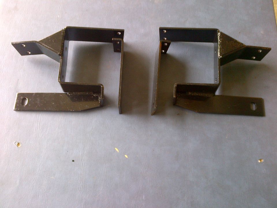 Pair of black metal brackets with mounting holes