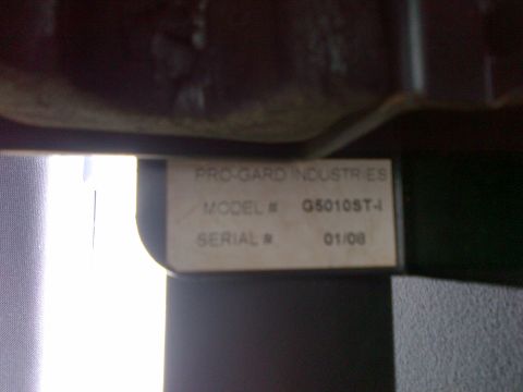 2001 Ford Crown Victoria - A label with manufacturing information is visible, but no vehicle details can be determined.