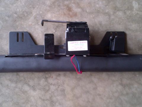 2001 Ford Crown Victoria - A close-up shows a trailer hitch wiring harness module with visible red and blue wires.