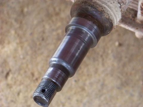 1995 Mercury Grand Marquis - This is a close-up view of a metal automotive spindle part.